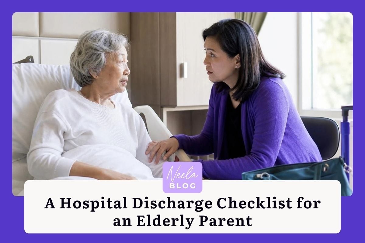 An adult daughter in a purple cardigan comforts her elderly mother in a hospital bed while discussing discharge plans.