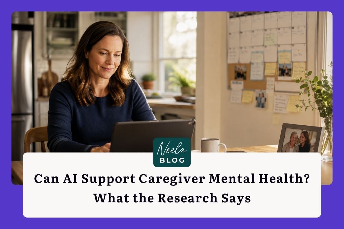 Family caregiver organizing appointments and notes on a tablet at a kitchen table, surrounded by a calendar, phone, and family photo in a warm, sunlit home.