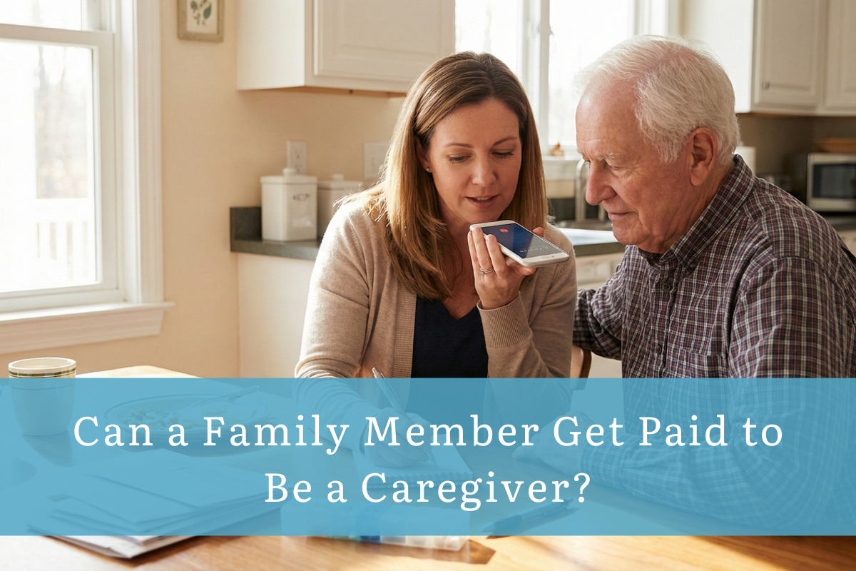 Woman assisting an older man at a kitchen table while holding a phone on speaker, with text reading “Can a Family Member Get Paid to Be a Caregiver?”