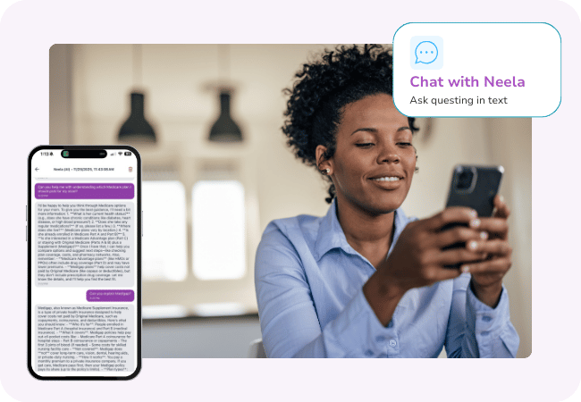 Caregiver smiling at her phone while Neela answers questions through the chat feature.